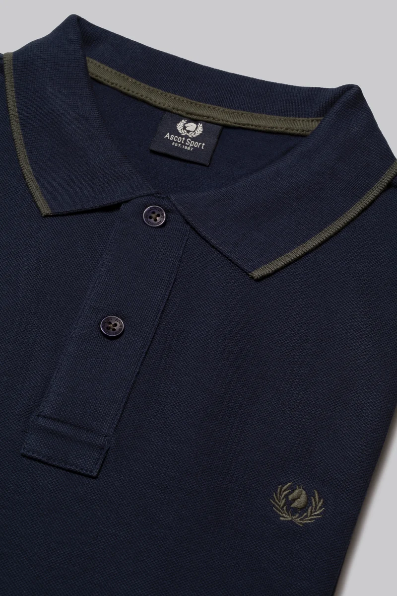 Polo in piquet con riga contrasto colore su collo e stampa logo sottocollo