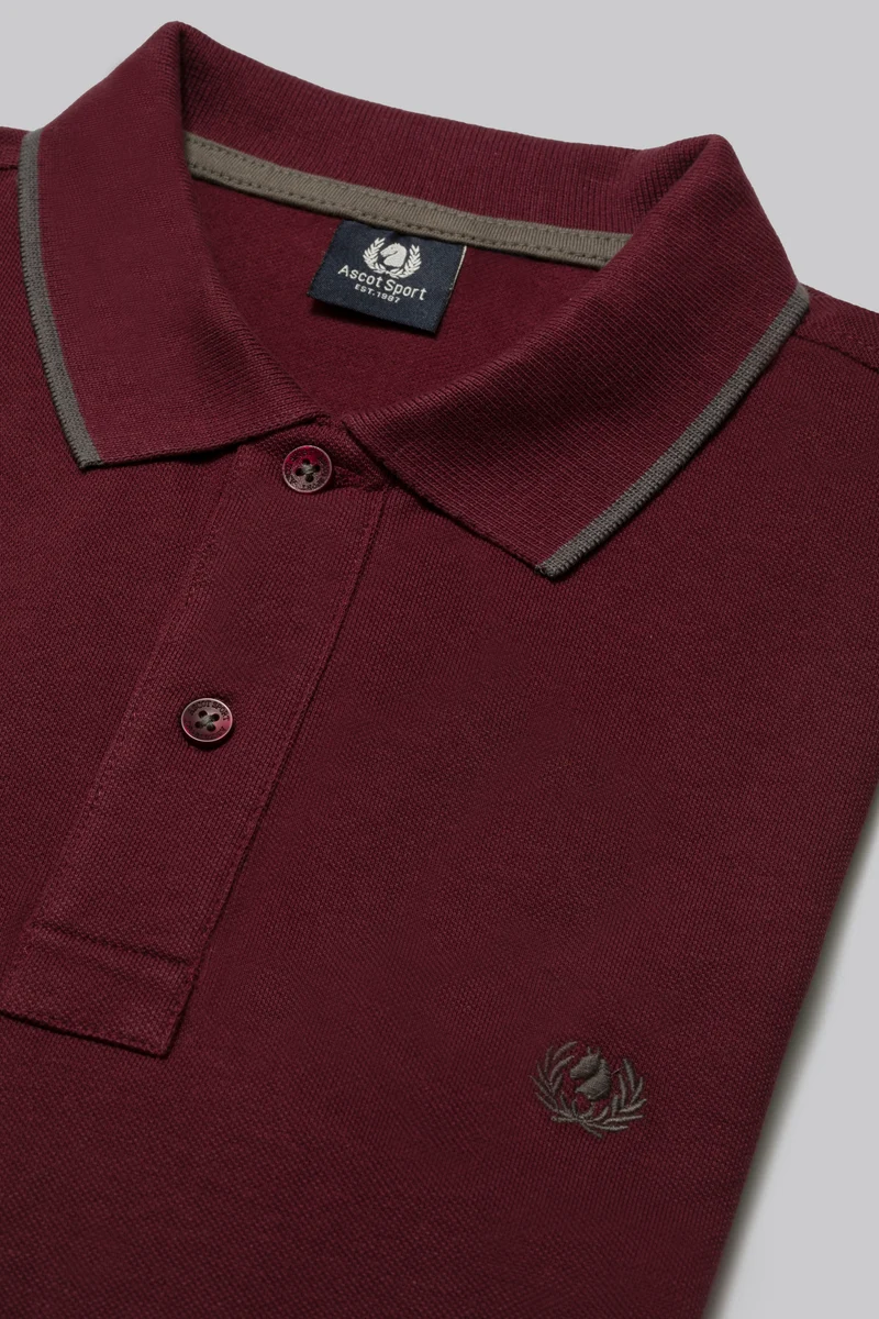Polo in piquet con riga contrasto colore su collo e stampa logo sottocollo