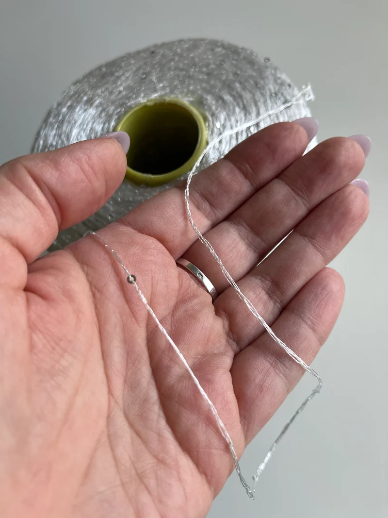 Paillettes Cofil su cono (argento su bianco)