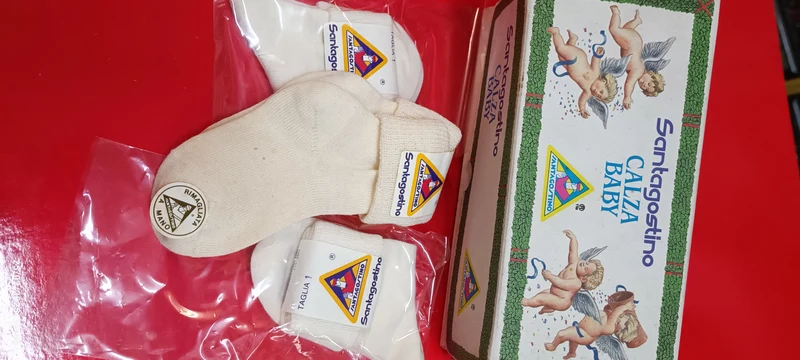 Sette paia di calzini baby bianchi, Santagostino, misura 1. 350 g.